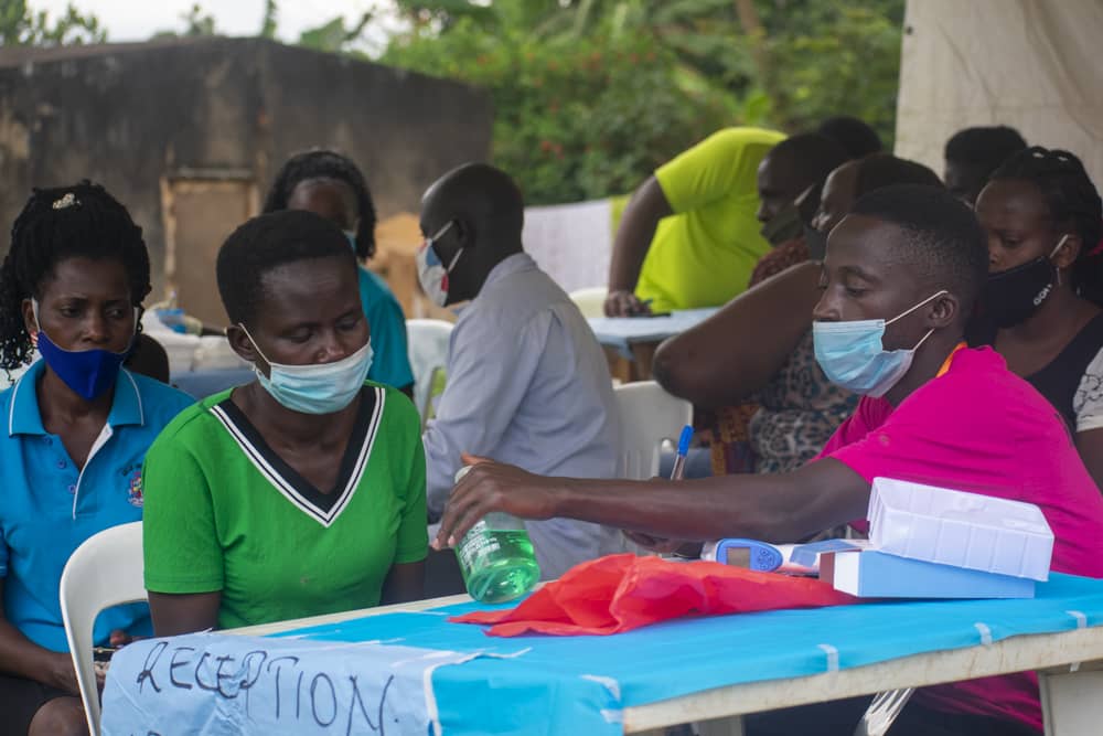 Held at Heart Uganda founders and community members outdoors together.